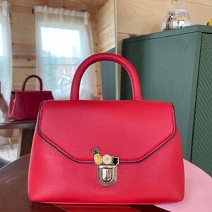 Zara purse in vibrant red with the fun buckle detail 🍍, 9”x6”,faux leather.